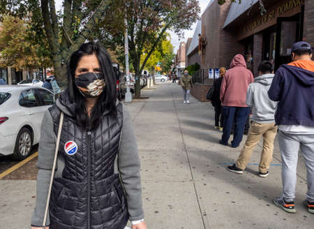 Brooklyn, NY, USA - October 27, 2020: Voters exit poll site after they cast their votes for early...
