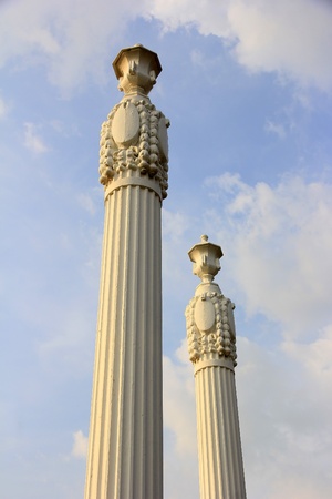 ancient greek pillars against a blue skyの写真素材