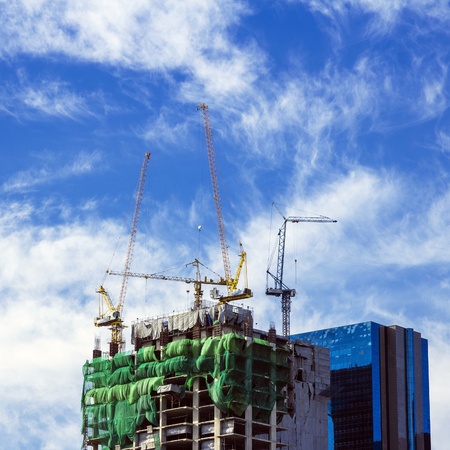 Construction in the daytime. The background is sky with clouds.の写真素材