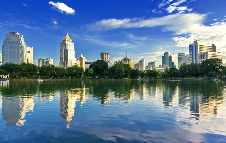 Garden in the city the daytime, blue sky and reflection in the lake.の写真素材