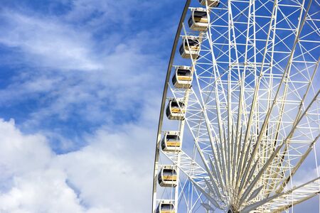 Ferris wheel with blue sky and cloud background.の写真素材