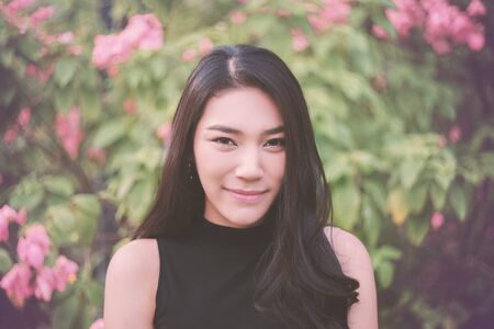 Outdoor portrait of a beautiful asian girl vintage tone.の写真素材