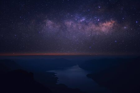 Clearly Milky way above the lake and mountain. Pha Dang Luang view point, Mae Ping National...