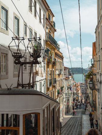Bica funicular, frozen in a single frame, showcases Lisbon's charm. The historic tram ascends the steep streets, a symbol of the city's character and heritageの写真素材