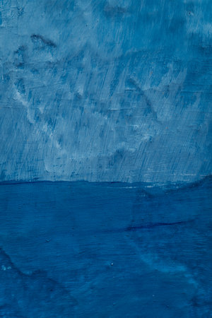 Vibrant blue wall texture: A captivating textured surface in striking blue, adding depth and character to any setting.の写真素材