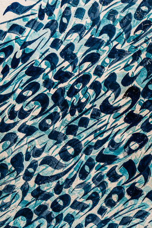 Blue Arabic calligraphy texture: Intricate and elegant, the blue Arabic calligraphy creates a mesmerizing texture.の写真素材