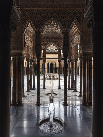 Alhambra's Court of the Lions: a serene oasis of beauty, where an elegant fountain and intricate architecture create a captivating ambiance.のeditorial素材