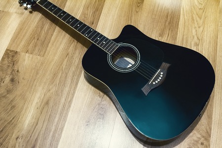 black acoustic guitar, contrast black and brownの写真素材