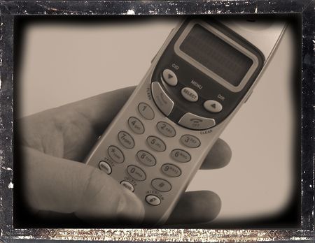 Cordless phone held in handの写真素材