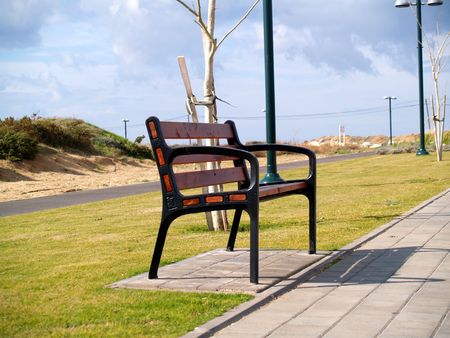 Picture of lone bench on a cloudy day