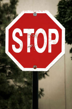 Stop sign with grungy backgroundの写真素材