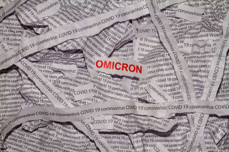 Strips of paper with the words Omicron, coronavirus and Covid-19 typed on paper. Omicron variant of COVID-19.の写真素材