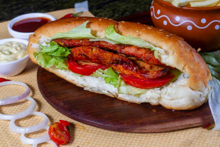 chicken tikka roll , tomato sauce and drink top view of arabic street food on wooden backgroundの写真素材