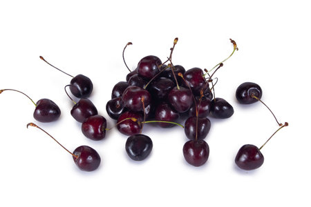 A fresh vivid red cherry isolated on white background