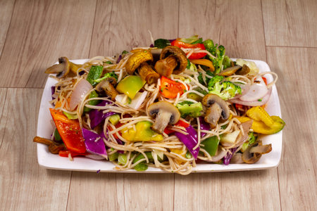 mix colorful vegetables hot noodles isolated on wooden backgroundの写真素材