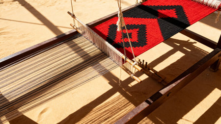Sadu Loom in Gulf Interior Space - Sunlit Traditional Weaving Workshop with Red Carpetの素材