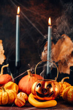 Spooky Halloween party, table with pumpkin decoration, candlesの写真素材