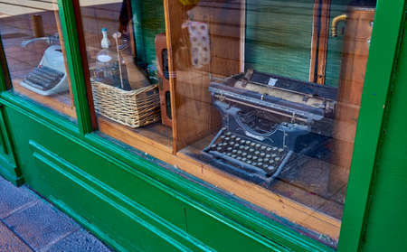 Green shop window with old typewriters