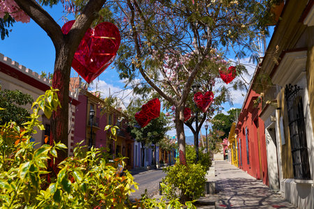 Street of Colors: Red Hearts Adorning Oaxaca