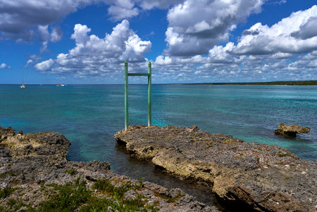 View of Bayahibe Bay with boats by the sea on coastal rocksの写真素材
