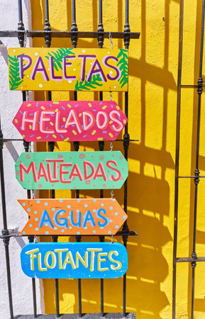 Boards with colorful advertisements for the drinks sold in a store.の写真素材
