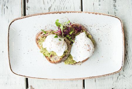 Poached eggs on toast breakfast food