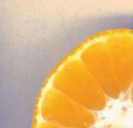 quater crop of orange, with soft background.の写真素材