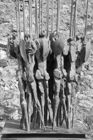 CHATEAU DE GRUYERES, GRUYERES, SWITZERLAND APRIL 6, 2012 - Spearmen sculpture by the Swiss artiss Arnoldi Nag outside the Chateau de Gruyeresのeditorial素材