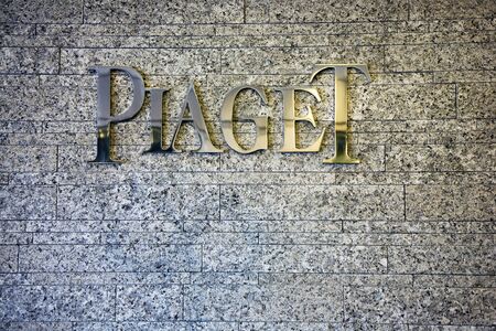 Geneva, Switzerland, April 4, 2011 - Piaget brand logo on a wall.  Piaget is a Swiss luxury watchmaker and jeweller.  The company was founded in 1874 by Georges Piaget in the village of La CÃ´te-aux-FÃ©es. It now belongs to the Swiss Richemont group.のeditorial素材