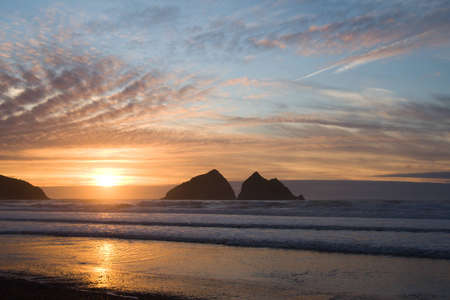 Carter's Rocks (a.k.a. Gull Rocks) at Hollywell Bay (Cornwall, UK) at sunset.の写真素材