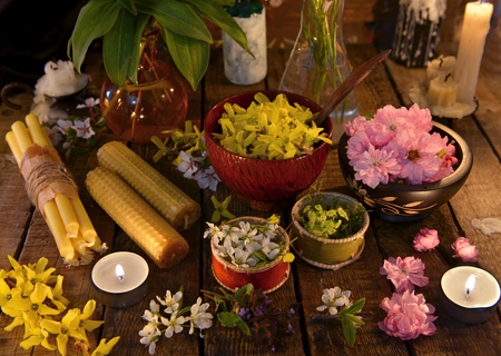 Still life with candles, healing herbs and flowers. Alternative medicine vintage conceptの写真素材