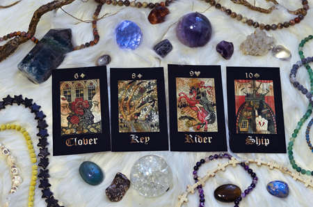 Gothic tarot cards with crystals and ritual magic objects. Esoteric, gothic and occult background,...