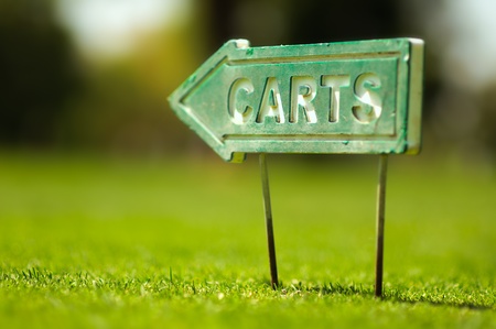 Golf carts sign on a golf field. Small depth of field.の写真素材