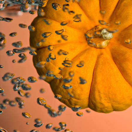 Pumpkin in a drop tank with air bubbles