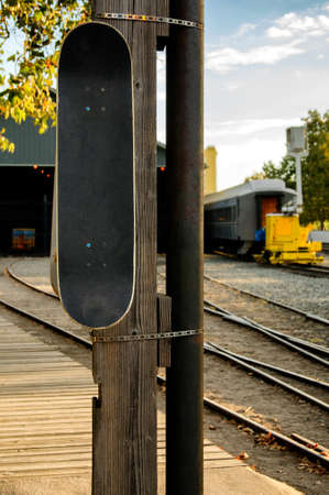 skateboard on a wooden light pole on train depoの写真素材