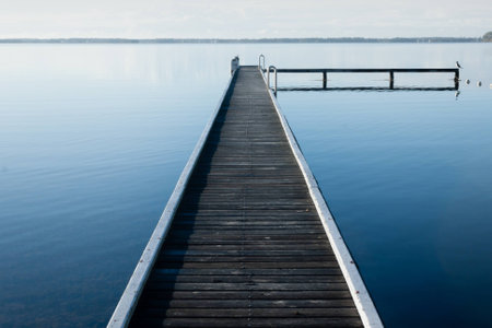 jetty at Lake Macquarie with slight fog in the distanceの写真素材