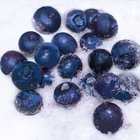 Frozen blueberries close up. Blue berries on white backgroundの写真素材