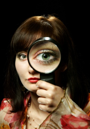The girl with a magnifierの写真素材
