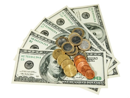 Dollars and euro coins on a white backgroundの写真素材