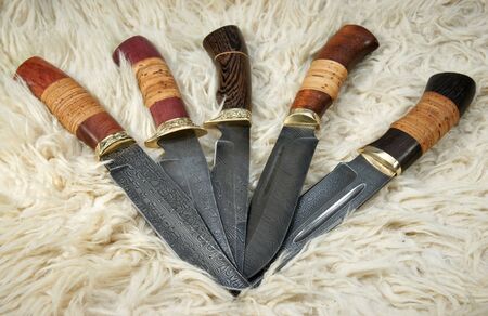 The hunting knifes on a skin of a ramの写真素材