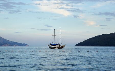 The lonely yacht in the sea in the evening                              の写真素材