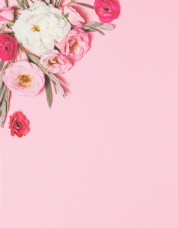 Flowers composition. Border from english rose flowers on pink background. Spring, summer, easter concept. Flat lay, top view, copy space. Vintage styleの写真素材