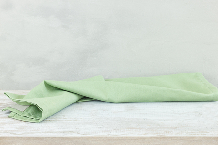 Empty table with tablecloth over grunge backgroundの写真素材