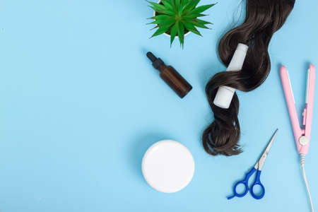 Hairdresser tools on blue background with copy space. Professional hair dresser toolsの写真素材