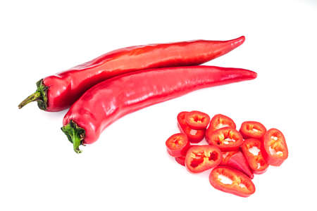 Set of whole and chopped red Hungarian Hot Wax pepper or paprika (Capsicum annuum). Chili pepper
