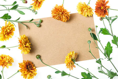 Flowers composition from chrysanthemum flowers. Yellow flowers on white background. Flat lay, top view, copy space. Floral backdropの写真素材