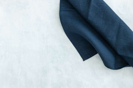 Blue napkin on gray background. Decorative kitcchen cotton towel.の写真素材