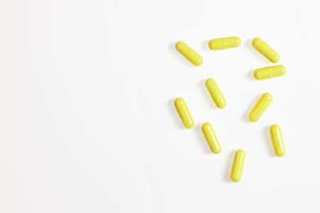 Pharmaceutical medicine pills, tablets and capsules on white background. Medicines blue. Copy space...