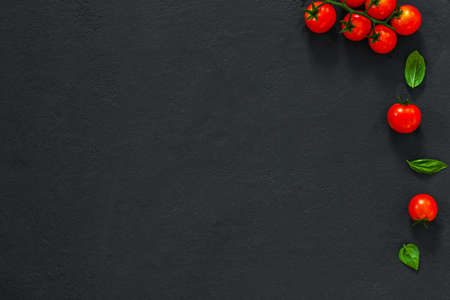 ? lassic italian background made tomato and basil on dark table. View from above, horizontalの写真素材