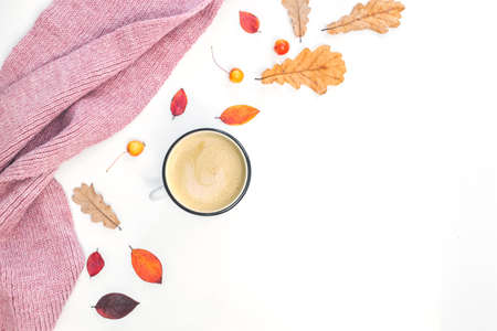 Autumn composition. Cup of coffee, women scarf, autumn leaves on white background. Flat lay, top...